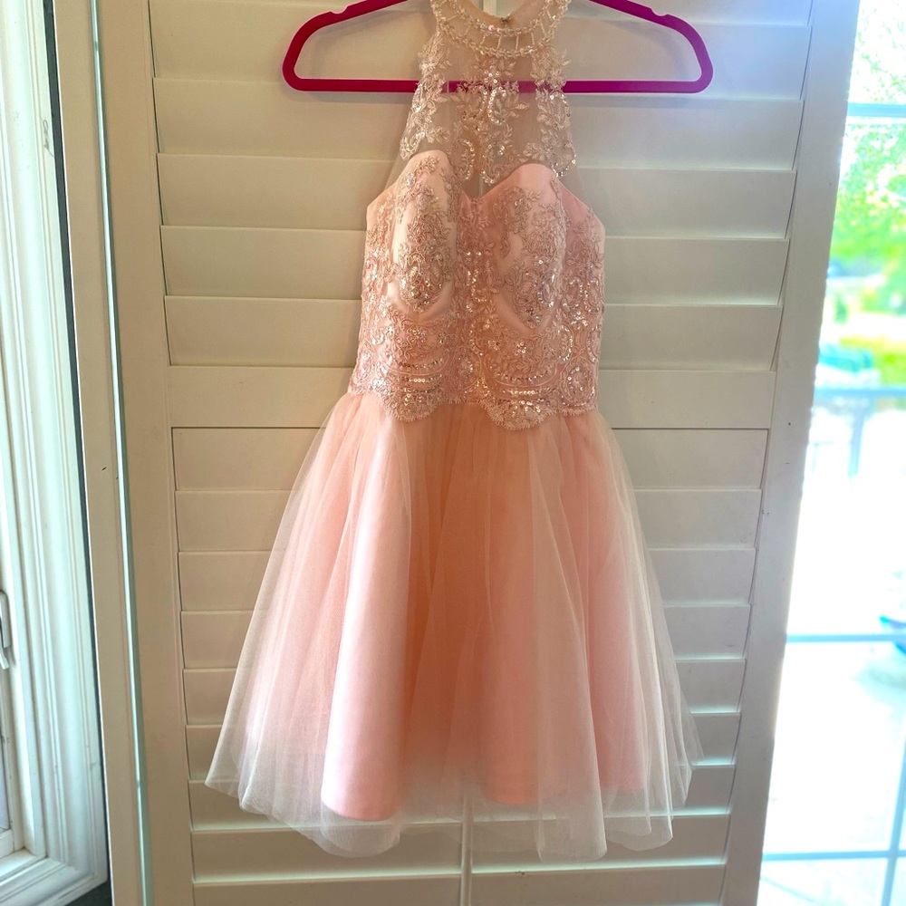 My daughter wore this one time to her 8th grade dance, light pink with beading